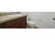 Bathroom featuring a sleek vanity with a light countertop and a toilet at 4949 Olivia Ct, St Cloud, FL 34772
