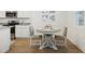 Cozy dining area featuring a round table, four chairs, and stylish decor at 4949 Olivia Ct, St Cloud, FL 34772