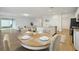 Open concept dining room featuring contemporary decor and access to the kitchen and living area at 4949 Olivia Ct, St Cloud, FL 34772