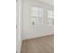 Minimalist room with hardwood floors and bright natural lighting at 4949 Olivia Ct, St Cloud, FL 34772