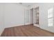 Clean, empty room featuring hardwood floors and French doors at 4949 Olivia Ct, St Cloud, FL 34772
