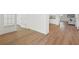 Spacious hallway with hardwood floors and view into the kitchen at 4949 Olivia Ct, St Cloud, FL 34772