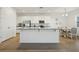 Bright kitchen with white cabinetry, granite countertops, and stainless steel appliances at 4949 Olivia Ct, St Cloud, FL 34772