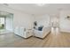 Spacious living room with an open floor plan and access to the outdoor patio, perfect for entertaining at 4949 Olivia Ct, St Cloud, FL 34772