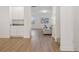 Bright, open-concept living area with hardwood floors, white cabinets, and comfortable seating at 4949 Olivia Ct, St Cloud, FL 34772