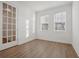 Bright office with natural light, hardwood floors, and glass French doors at 4949 Olivia Ct, St Cloud, FL 34772