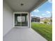 Covered patio provides views of the lush backyard, ideal for relaxing and enjoying the outdoors at 4949 Olivia Ct, St Cloud, FL 34772