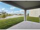 Enjoy the beautiful pond view from this covered patio, perfect for outdoor gatherings at 4949 Olivia Ct, St Cloud, FL 34772