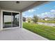 Covered patio overlooking a serene pond, offering a peaceful outdoor living space at 4949 Olivia Ct, St Cloud, FL 34772