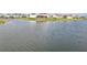 A view of the neighborhood shows waterfront properties featuring solar panels and fenced yards at 4949 Olivia Ct, St Cloud, FL 34772