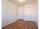 A clean bedroom with wood floors and a closet at 4712 Hemingway House St, Kissimmee, FL 34746