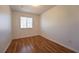 Bedroom with wood floors and a window at 4712 Hemingway House St, Kissimmee, FL 34746