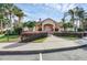 Exterior view of the clubhouse with sidewalks and surrounding shrubbery at 4712 Hemingway House St, Kissimmee, FL 34746