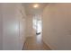 Bright hallway with tile flooring leading to stairs and open living area at 4712 Hemingway House St, Kissimmee, FL 34746