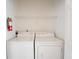 Inside laundry room with a full-size washer and dryer for added convenience at 4712 Hemingway House St, Kissimmee, FL 34746