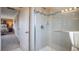 Clean bathroom with a walk-in shower, neutral tile and modern vanity at 2933 Mango Tree Dr, Edgewater, FL 32141