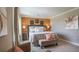 Bright bedroom with a king-size bed, neutral color palette and accent chair at 2933 Mango Tree Dr, Edgewater, FL 32141