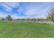 Green backyard extends to a scenic lake, offering a tranquil and picturesque setting at 2933 Fable St, Kissimmee, FL 34746