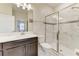Modern bathroom featuring a glass-enclosed shower, dark vanity, and stylish tile work at 2933 Fable St, Kissimmee, FL 34746