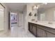 Spacious bathroom with double sinks, modern lighting, and a walk-in shower at 2933 Fable St, Kissimmee, FL 34746