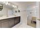 Bright bathroom featuring double vanity, stylish lighting, and sleek marble floors at 2933 Fable St, Kissimmee, FL 34746
