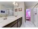Bright bathroom with double sinks and a stylish shower at 2933 Fable St, Kissimmee, FL 34746