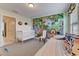 Adorable Bedroom features a safari-themed mural, a crib, and a toddler bed with decorative pillows at 2933 Fable St, Kissimmee, FL 34746