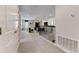 Bright hallway leads to a living room with modern furnishings and stylish décor at 2933 Fable St, Kissimmee, FL 34746