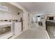 Convenient laundry area near bedrooms with modern appliances and storage, adding functionality to the home at 2933 Fable St, Kissimmee, FL 34746