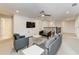 Living room with modern decor, including a TV and textured wall, perfect for entertaining or relaxing at 2933 Fable St, Kissimmee, FL 34746