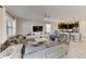 Open-concept living room that flows into the kitchen, offering a modern and spacious living space at 2933 Fable St, Kissimmee, FL 34746