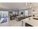 Spacious living room with pool view, modern decor, and an open concept layout to the kitchen at 2933 Fable St, Kissimmee, FL 34746