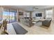 Spacious living room featuring a large sliding glass door to the pool and backyard waterfront at 2933 Fable St, Kissimmee, FL 34746