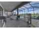 Covered patio features a dining area and seating, with views of the pool and waterfront at 2933 Fable St, Kissimmee, FL 34746