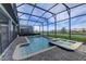 Private screened-in pool and spa offer a relaxing retreat with beautiful lake views at 2933 Fable St, Kissimmee, FL 34746
