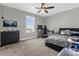 Bedroom with neutral color palette, carpet, and a large window for natural light; furnished as an office at 3318 Current Ave, Winter Garden, FL 34787