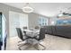 Stylish dining area featuring a modern table, chairs, and sliding glass doors for indoor-outdoor living at 3318 Current Ave, Winter Garden, FL 34787