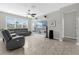 Cozy living room with comfortable seating, a ceiling fan, and a large window for natural light at 3318 Current Ave, Winter Garden, FL 34787