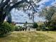 Beautiful backyard with a view of the lake and lush landscaping at 750 E Michigan St # 163, Orlando, FL 32806