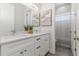 Bathroom with double sink vanity, granite counters, and stylish fixtures at 839 Waterfern Trail Dr, Auburndale, FL 33823