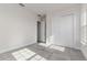Bright bedroom featuring tile floors, neutral walls, a closet, and a window offering plenty of natural light at 839 Waterfern Trail Dr, Auburndale, FL 33823