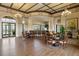 The clubhouse features seating, chandeliers, and a bar area with water views at 839 Waterfern Trail Dr, Auburndale, FL 33823