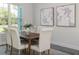 Elegant dining area features a wooden table, comfortable chairs, and natural lighting at 839 Waterfern Trail Dr, Auburndale, FL 33823