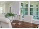 Cozy dining room with wood table, decorative accents, and natural light from the large window at 839 Waterfern Trail Dr, Auburndale, FL 33823