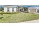 Well-manicured front lawn and landscaping accent this modern home's exterior at 839 Waterfern Trail Dr, Auburndale, FL 33823