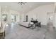 Spacious living area showcasing tile floors and a seamless flow to other rooms at 839 Waterfern Trail Dr, Auburndale, FL 33823