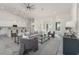 Bright and airy living room featuring high ceilings and an open floor plan at 839 Waterfern Trail Dr, Auburndale, FL 33823