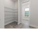 Spacious pantry with wire shelving and views to other rooms at 839 Waterfern Trail Dr, Auburndale, FL 33823