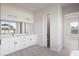 Modern bathroom with double vanity and a view into another room at 208 Snowy Orchid Way, Lake Alfred, FL 33850