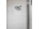 Clean bathroom with a large shower head and white tile at 208 Snowy Orchid Way, Lake Alfred, FL 33850